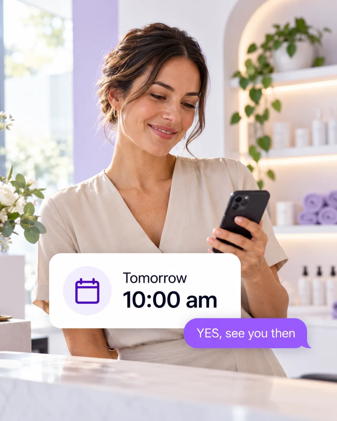 A wellness business team member checking an appointment reminder and customer reply